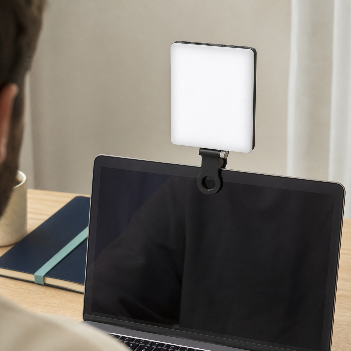 Clip-on filming light shown with phone, camera and laptop setups